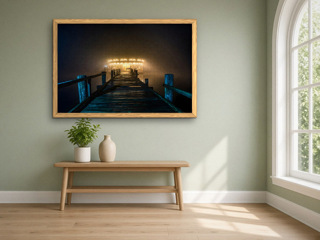The Carousel at the End of the Pier 1014 piece puzzle assembled, framed in light wood on a sage green wall above a wooden bench, next to a tall arched window
