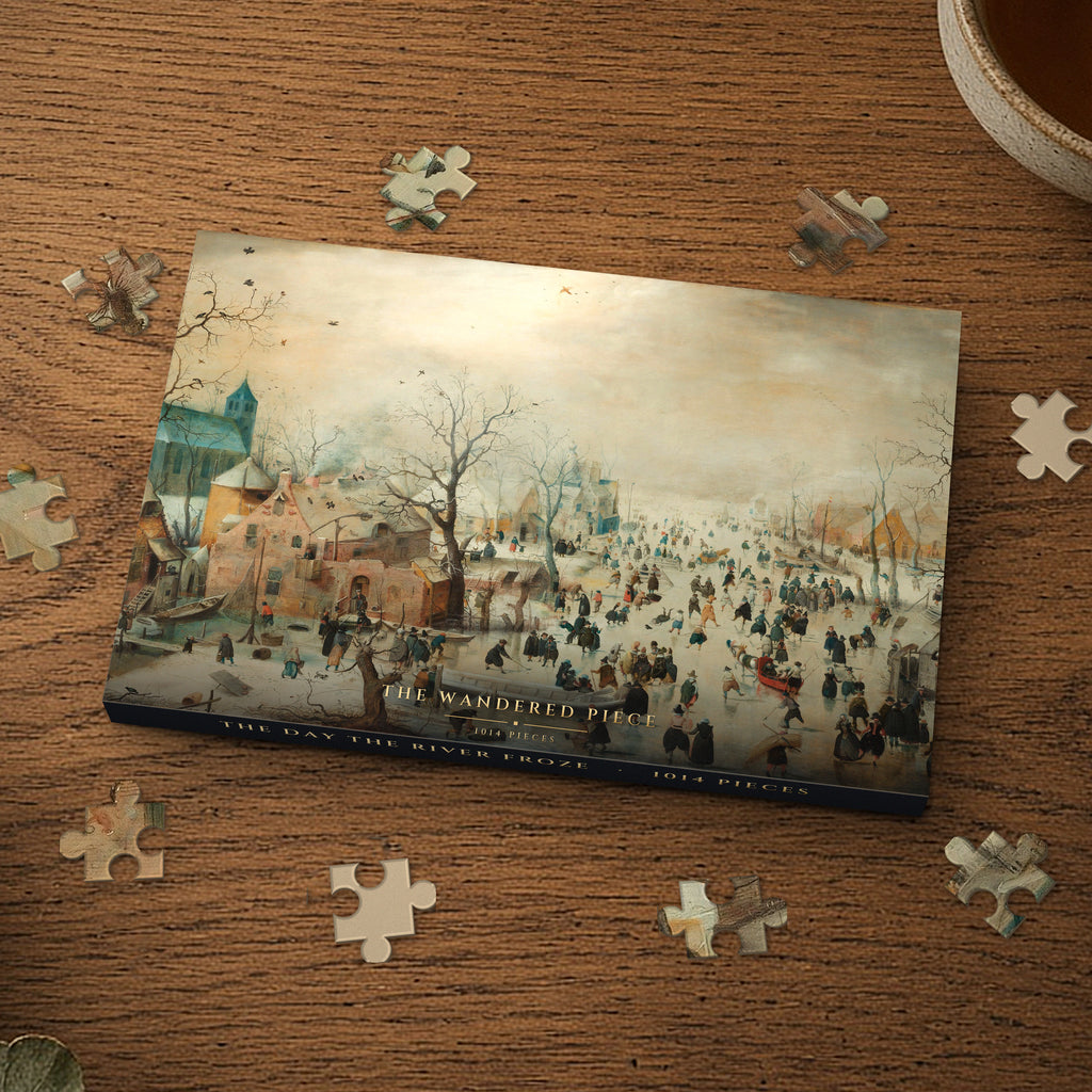 The Day the River Froze 1014 piece puzzle box on a wood table with loose pieces, box design shown for illustration
