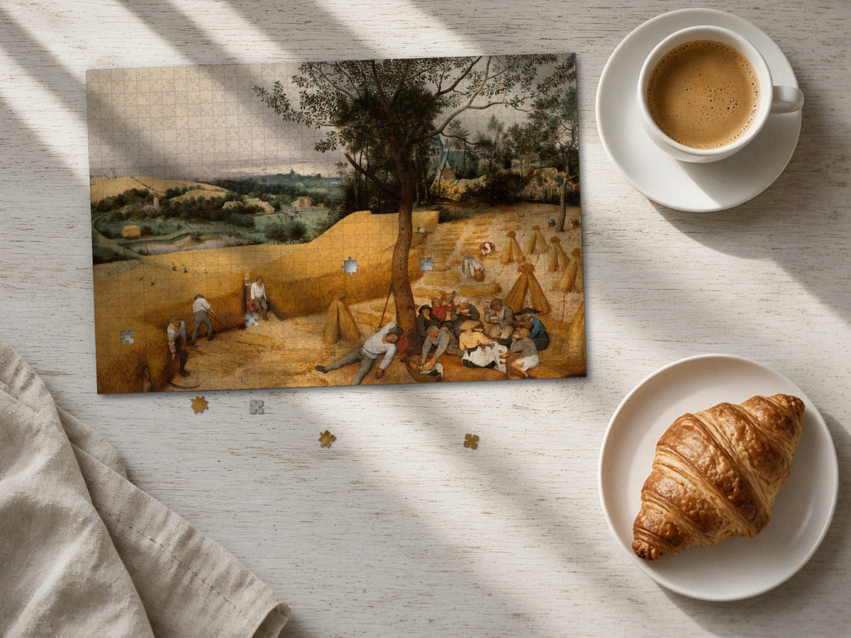 The Long Gold Afternoon 1014 piece puzzle laid flat on a pale wood table in morning sun beside a cappuccino and a croissant