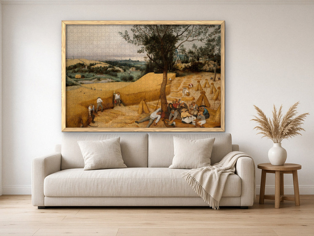 The Long Gold Afternoon 1014 piece puzzle assembled, framed in light wood and hung above a cream sofa, with pampas grass on a side table