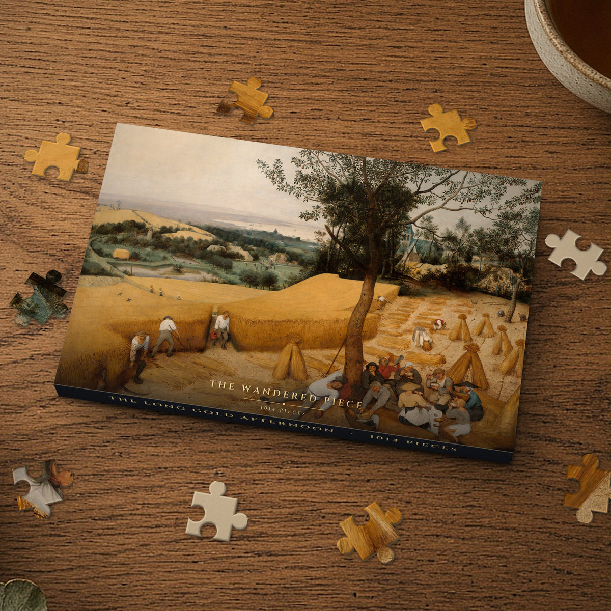 The Long Gold Afternoon 1014 piece puzzle box on a wood table with loose pieces, box design shown for illustration