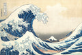 The Wave Before the Mountain art puzzle: Hokusai's Great Wave, a towering blue and white wave curling over three rowing boats, with snow-capped Mount Fuji small in the distance