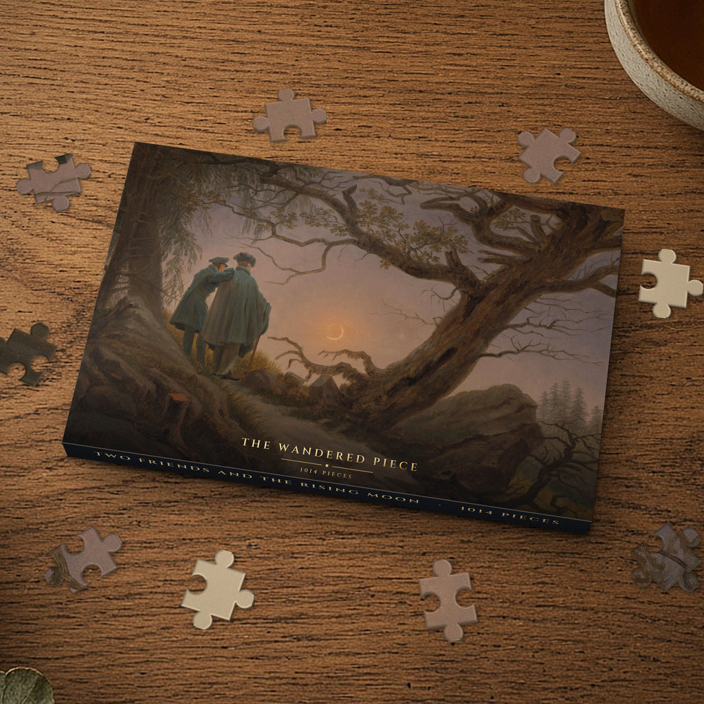 Two Friends and the Rising Moon 1014 piece puzzle box on a wood table with loose pieces, box design shown for illustration
